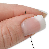 Fingers holding thread